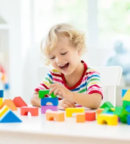 depositphotos_242673214-stock-photo-kid-playing-colorful-toy-blocks