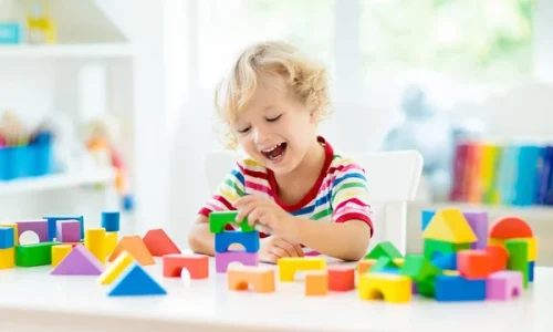 depositphotos_242673214-stock-photo-kid-playing-colorful-toy-blocks